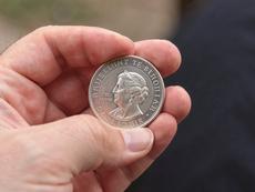 Hand Holding Coin