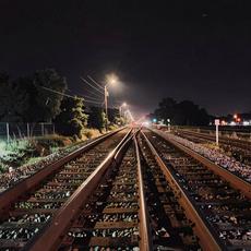 Railroad Tracks At Night