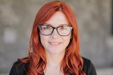 Red Haired Woman With Glasses