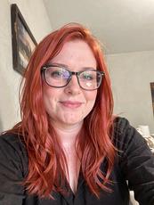 Redhead Woman With Glasses