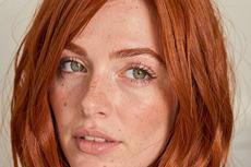 Redhead Woman With Green Eyes