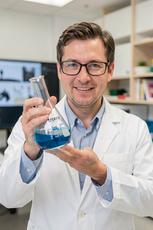 Scientist Holding Flask